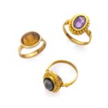 THREE RARE RINGS with mount in yellow gold 18 kts., with antique carnelians and amethyst engraved