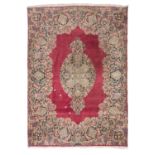 BEAUTIFUL KIRMAN CARPET, EARLY 20TH CENTURY medallion with flower branches and garlands in a red