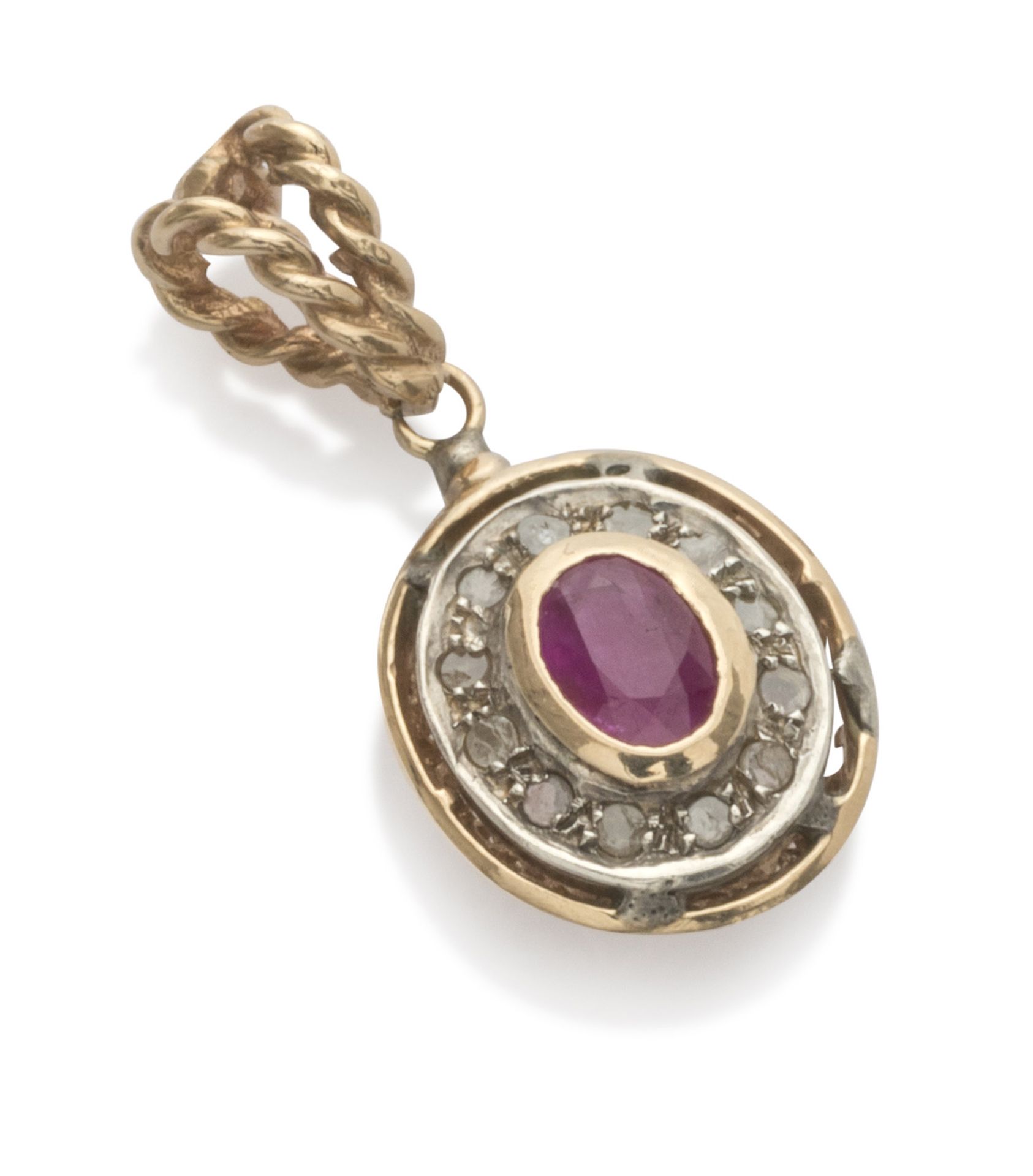 PENDANT in yellow gold 18 kts. and silver, oval shape with central ruby edged by rose cut