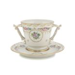 CUP AND SAUCER IN PORCELAIN, LIMOGES 20TH CENTURY decorated with flowers and gold. Bush handles.