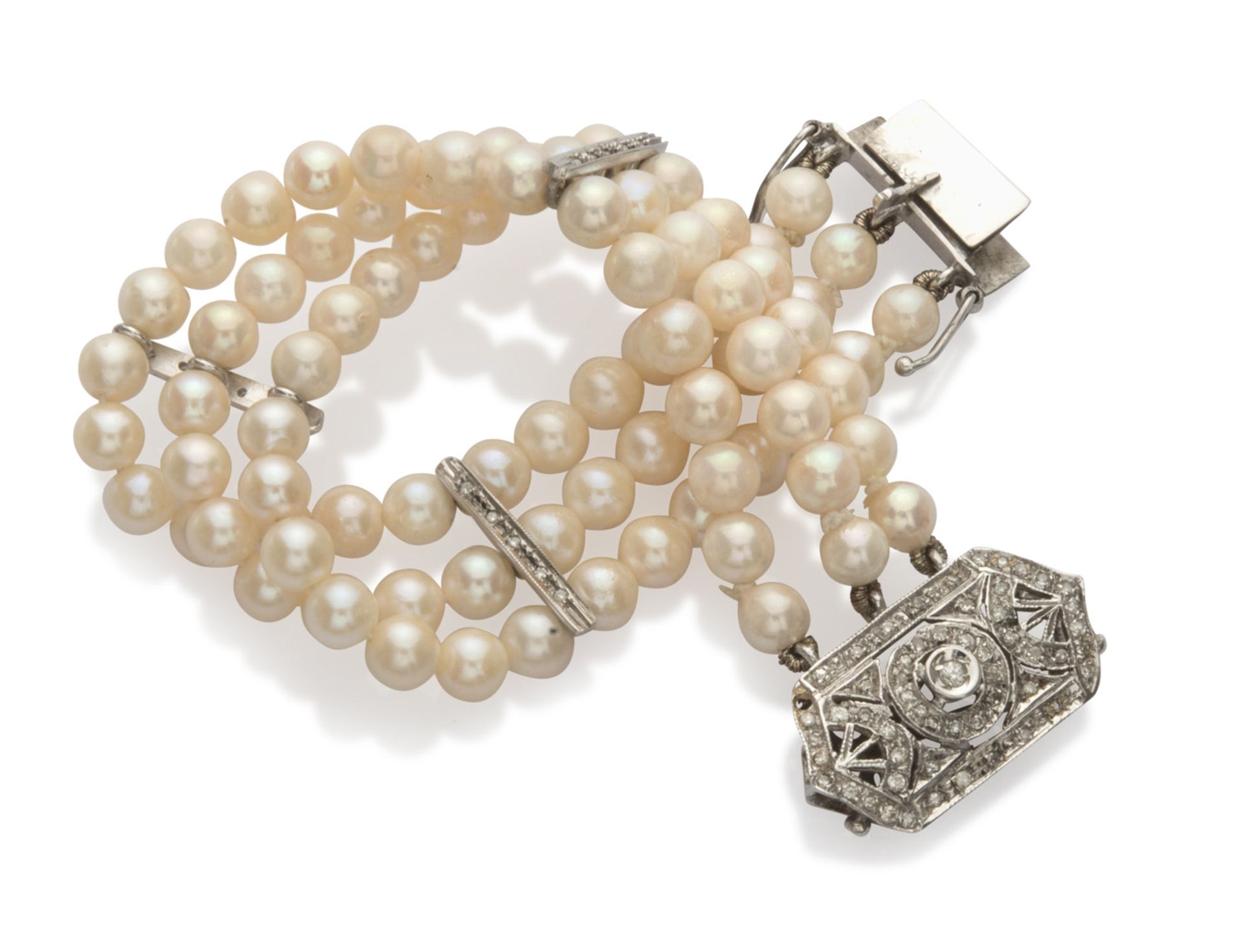 SPLENDID BRACELET band in white gold 18 kts., with three threads of pearls alternated with diamond