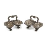 A PAIR OF SALTCELLARS IN SILVER, 20TH CENTURY with shell-shaped bodies. Unidentified punch. Title