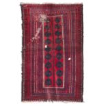 BELUCISTAN CARPET, 20TH CENTURY with leaf decor on a red ground. Measures cm. 130 x 82. Defects,