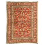 MACHINE KNOTTED RUG, 20TH CENTURY Perepedil design on red base. Size 230 x 175 cm. TAPPETO A