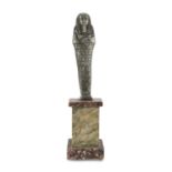 USHABTI IN PEWTER, EGYPTIAN STYLE 20TH CENTURY engraved with pictographic motifs. Wood base