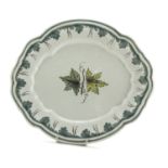 MAIOLICA DISH, PROBABLY FAENZA 19TH CENTURY in white and green enamel decorated with ivy leaves.