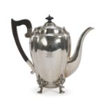 SILVER TEAPOT, PUNCH LONDON 1908 lobed body with wooden handle and knob. Leafy feet. Silversmith