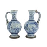 A PAIR OF MAIOLICA PITCHERS, HOLLAND EARLY 19TH CENTURY in light blue enamel, decorated with