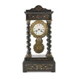 TEMPLE CLOCK IN EBONIZED WOOD, 19TH CENTURY with inlays in brass and turtle. Twisted columns,