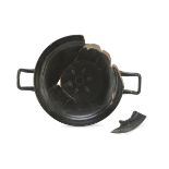 BLACK-GLAZED KYLIX, 4th CENTURY B.C. in rosy clay with black shining glaze, fragmentary. Measures