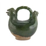 GREEN GLAZED CERAMIC PITCHER, CHINA 20TH CENTURY with final of zoomorphic shape. Measures cm. 20 x