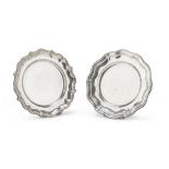 Two Silver-plated Saucers, 20TH CENTURY round shape with moved edge. Diameter cm. 22. DUE PIATTINI