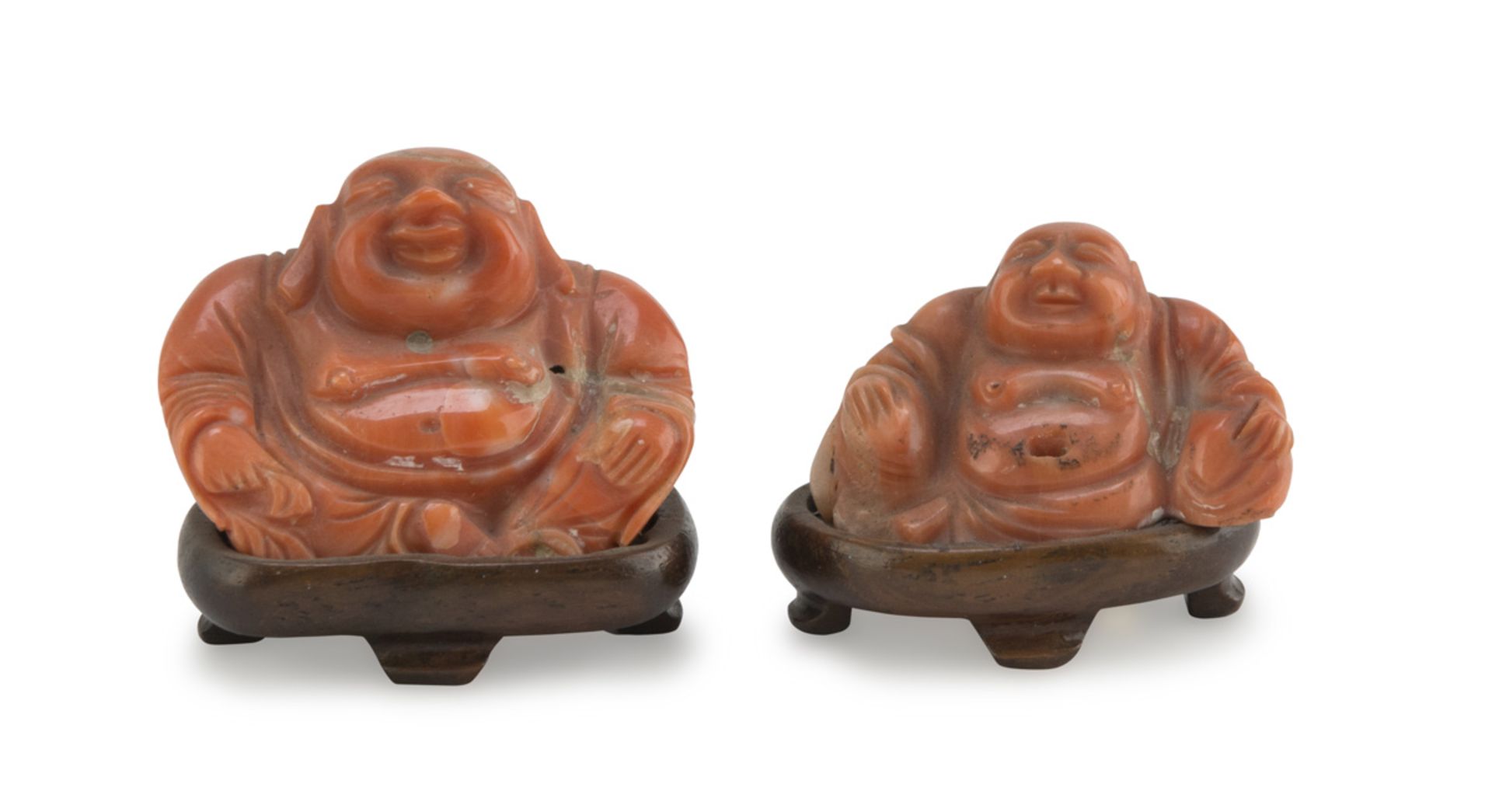 TWO CORAL SCULPTURES, CHINA EARLY 20TH CENTURY representing Budai portrayed in the classical