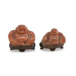 TWO CORAL SCULPTURES, CHINA EARLY 20TH CENTURY representing Budai portrayed in the classical