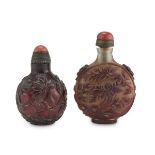 TWO LARGE SNUFF BOTTLE IN GLASS, CHINA 20TH CENTURY decorated with peonies and blooming lotus.