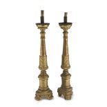 Pair of Giltwood candlesticks, 18TH CENTURY with sculpted shafts to leaves and pods. Measures cm. 70