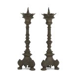 A PAIR OF SMALL CANDLESTICKS IN BRONZE, 19TH CENTURY with burnished patina and polygonal shafts.