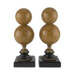 A PAIR OF SPHERES IN YELLOW MARBLE, EARLY 20TH CENTURY shaped as double pumpkin and base in black