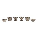 SIX SILVER EGG CUPS, UNITED KINGDOM EARLY 20TH CENTURY fluted bodies engraved with vegetal motifs.