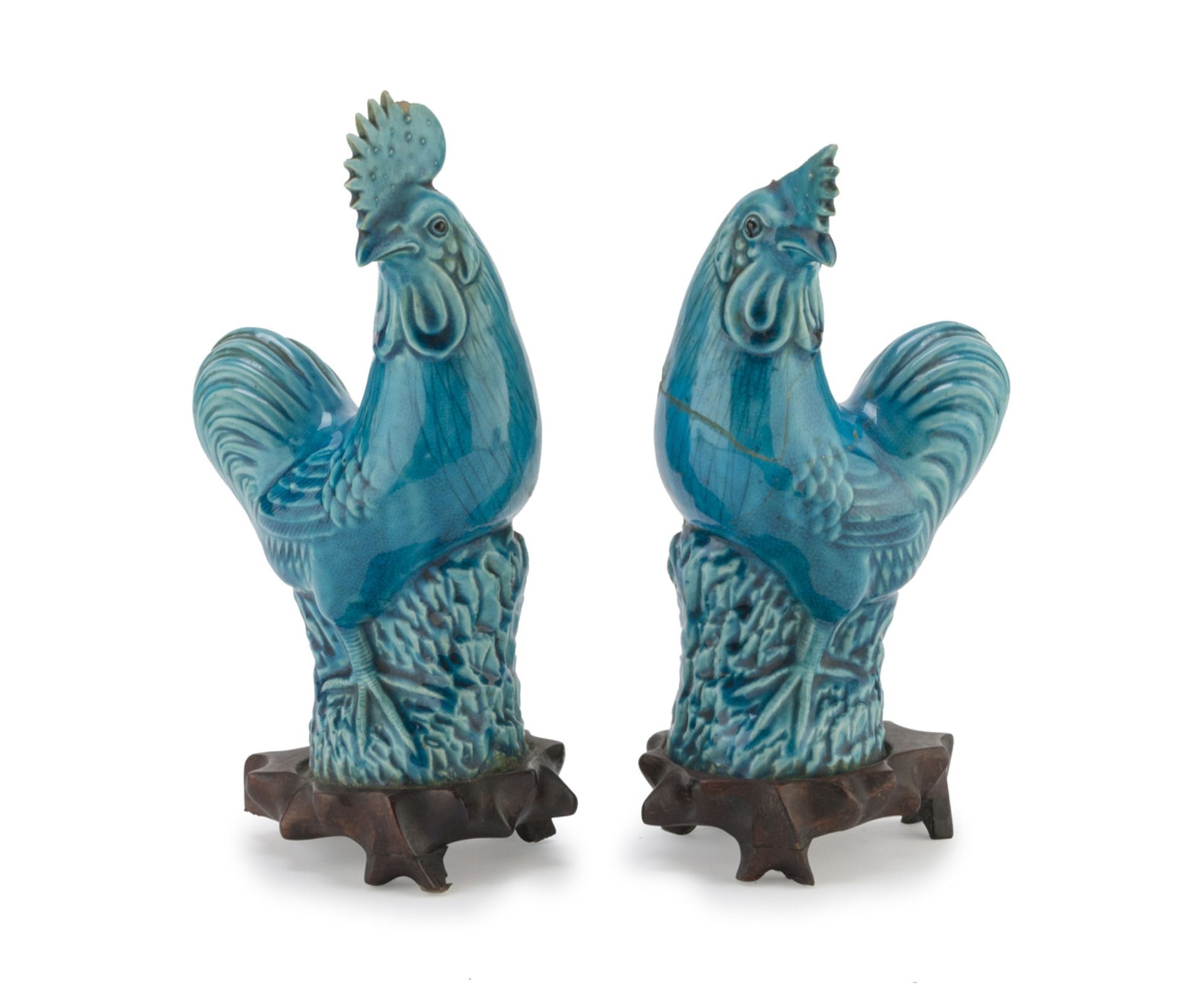 A PAIR OF SCULPTURES IN GLAZED CERAMICS, CHINA, 20TH CENTURY representing two roosters on big rocks.