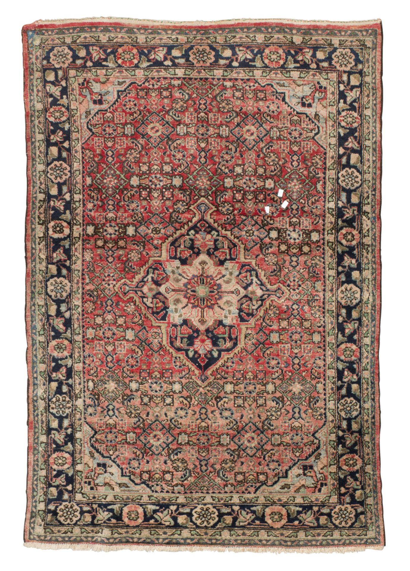 FERHAGAN CARPET, EARLY 20TH CENTURY with blue medallion and secondary motifs of rhombuses, small