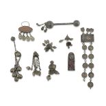 EIGHT NECKLACES IN METAL, MIDDLE EAST EARLY 20TH CENTURY consisting of two rattles, a buckle and