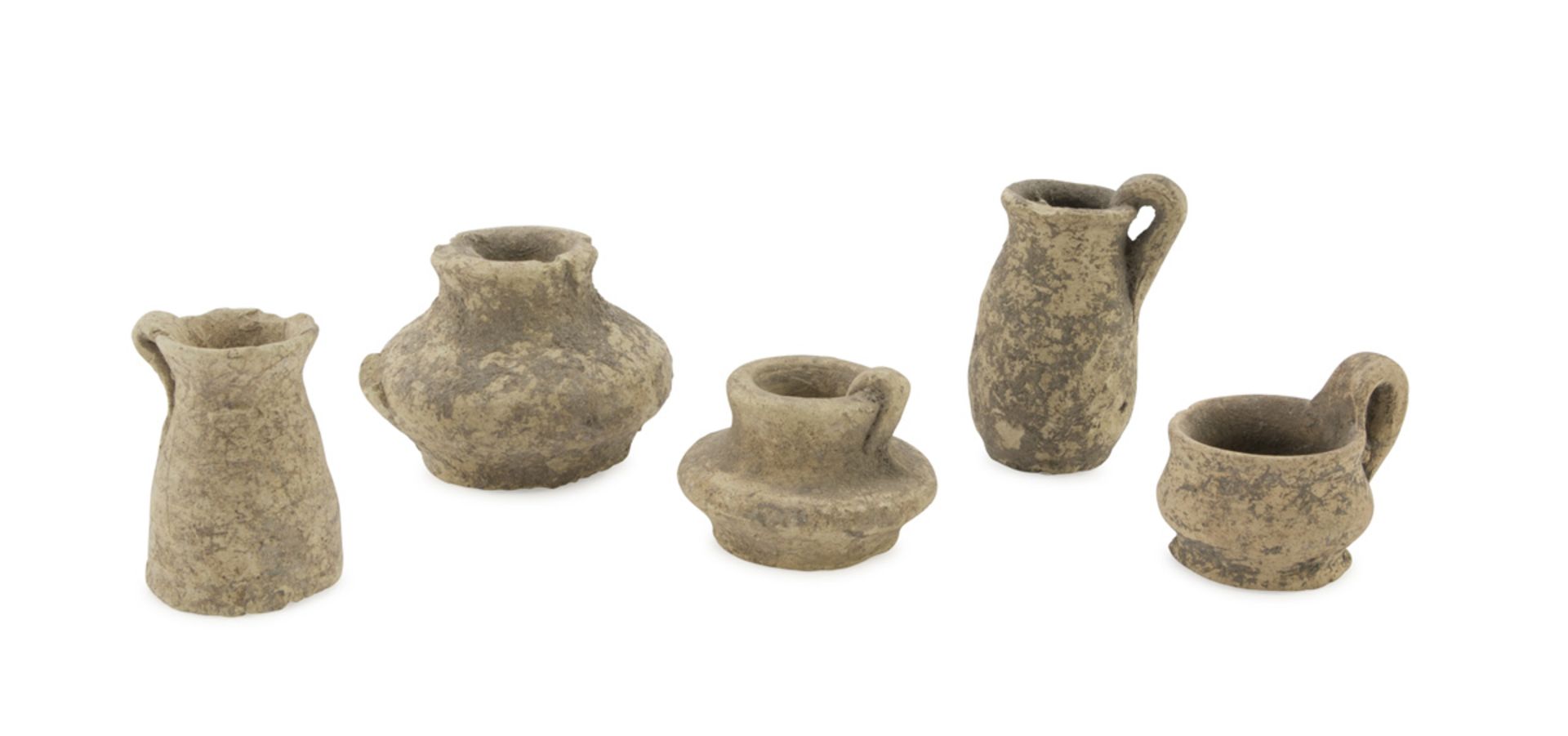 FIVE MINIATURE VASES, 5TH-4TH CENTURY B.C. in clay. Entire. h. cm. 3-6 The find is reported to the