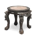 BASE IN EBONY, CHINA EARLY 20TH CENTURY with top in brocaded marble and legs carved to guardian