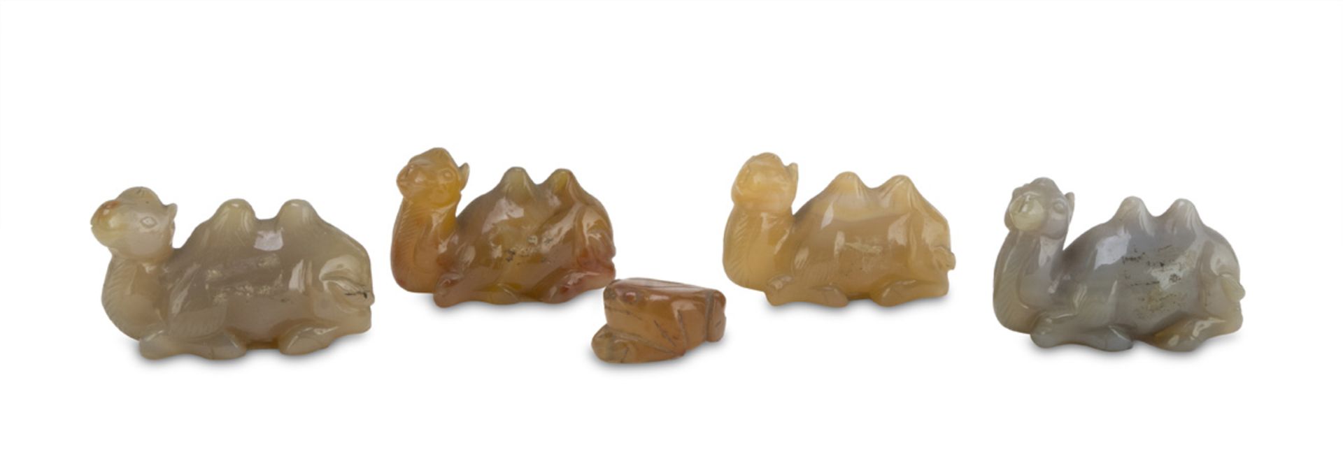 FIVE SMALL SCULPTURES IN CHALCEDONY, CHINA 20TH CENTURY representing four camels and a frog. Max.