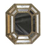MIRROR IN GILDED METAL, HOLLAND EARLY 20TH CENTURY with embossed edges. Measures cm. 64 x 56.