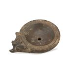 OIL LAMP IN EARTHENWARE, 1st-3rd CENTURY in rosy clay, varnished in brown. Damaged. Measures cm. 4 x