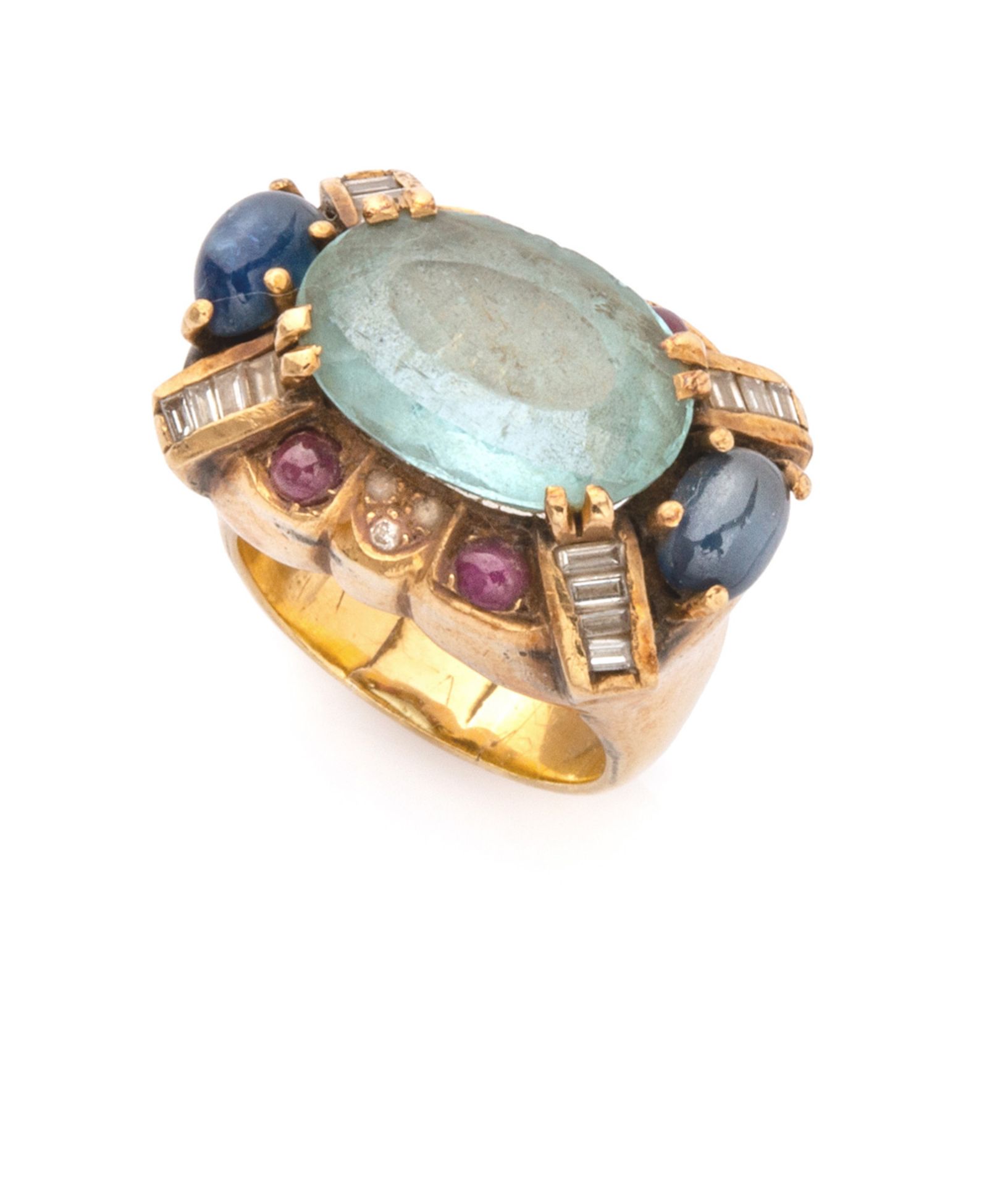 ANTIQUE RING in yellow gold 18 kts., dome-shaped with central aquamarine and contour of sapphires,