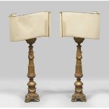 A PAIR OF GILTWOOD CANDLESTICKS, LATE 18TH CENTURY shaft sculpted to garlands and laurel leaves.