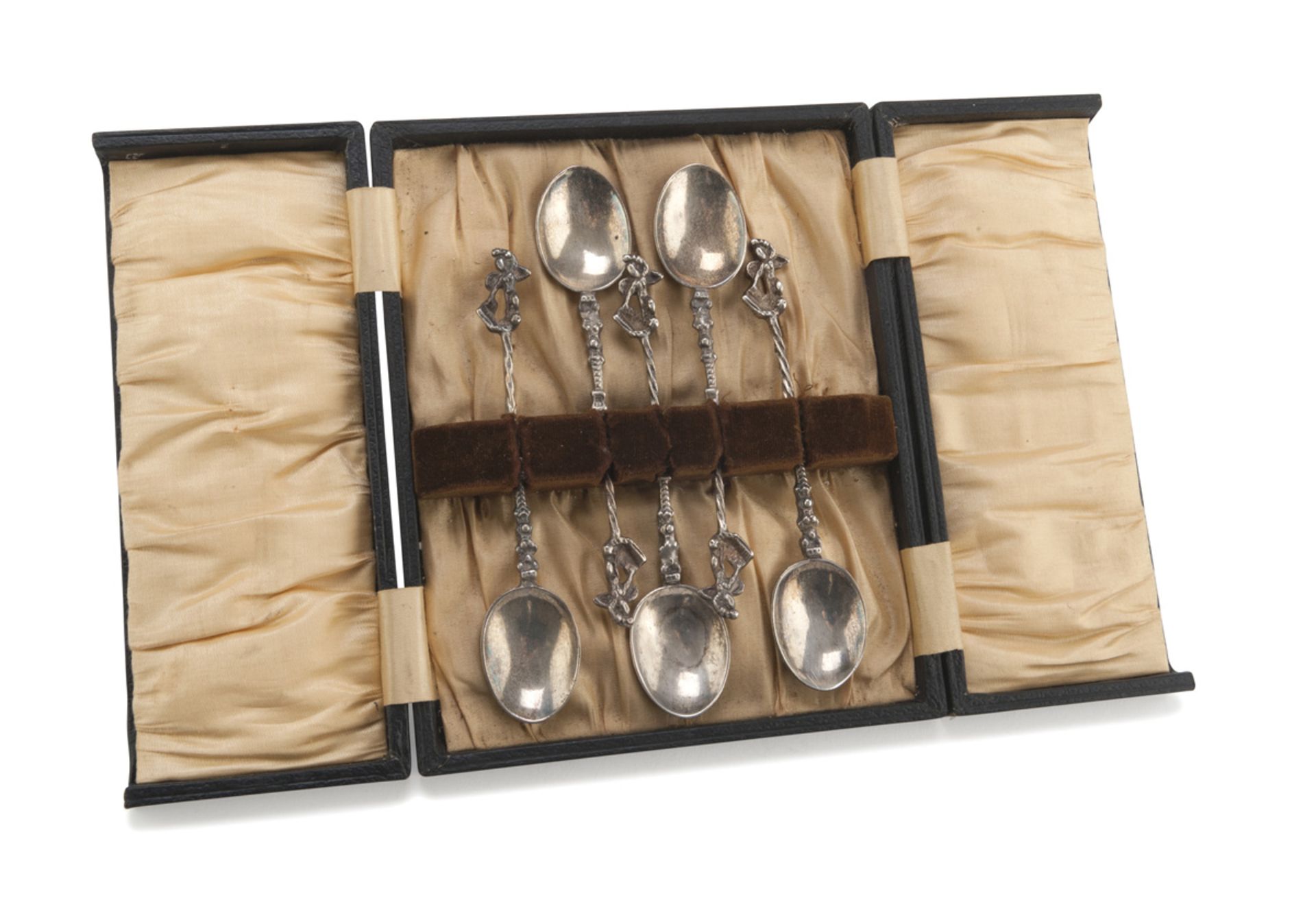 FIVE SILVER TEASPOONS, PUNCH LONDON 1892 with twisted handles, chiseled to Adamic figures.