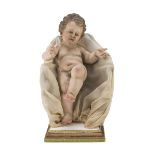 SCULPTURE OF A CHILD, NAPLES 19TH CENTURY polychrome lacquered, with glass eyes. Complete of seat in