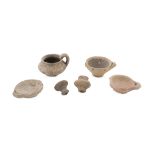 FIVE MINIATURE VASES, 5th-4th CENTURY B.C. in clay. Entire. Cm heights. 4 to cm. 1,5. The find is