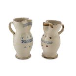 TWO CERAMIC PITCHERS, APULIA 19TH CENTURY in cream enamel decorated with flowers. Maximum size cm.