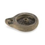 BLACK-GLAZED OIL LAMP, 2nd-1st CENTURY B.C. in bright beige clay and opaque black varnish. Entire.