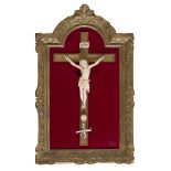 CRUCIFIX IN IVORY, 19TH CENTURY with wooden cross and giltwood frame with vegetal motifs. Measures