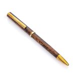 BALLPOINT PEN of brown color with fumé fantasy and finishes in gilded metal. Length cm. 15. PENNA