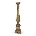 GILTWOOD CANDLESTICK, 18TH CENTURY shaft sculpted to palmette. Triangular base. h. cm. 91.