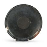 DISK IN ORANGE CLAY, 4TH CENTURY B.C. with shining black varnish, small lack on the edge. Measure