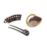 SMALL POCKET MIRROR AND TWO BARRETTES IN TURTLE, 20TH CENTURY one barrette with finishes in