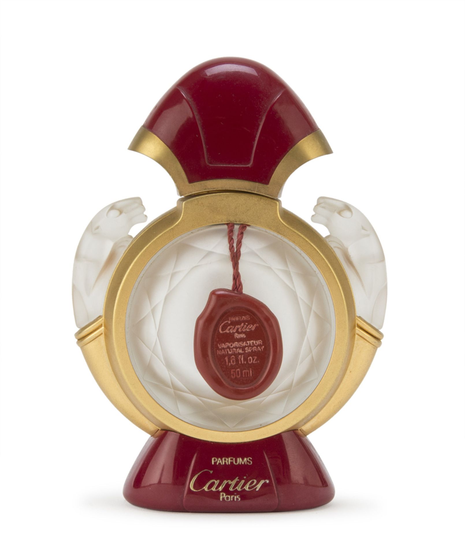 PERFUME BOTTLE IN OPALINES, CARTIER '80s with lions handles and finish in plastic and metal.