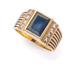 RING in yellow gold 18 kts., band with central blue stone and contour of diamonds. Diamonds ct. 0.20