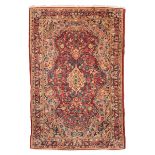 BAKTIARI CARPET, EARLY 20TH CENTURY with small medallion and secondary motifs of flower branches and