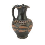 BLACK VARNISH APULIAN OINOCHOE, 4th-3rd CENTURY B.C. in beige clay and shining black varnish,