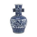 SMALL WHITE AND BLUE PORCELAIN VASE, CHINA LATE 19TH, EARLY 20TH CENTURY decorated with vegetal