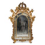 GILTWOOD MIRROR, GENOA, ELEMENTS OF THE 18TH CENTURY with arched top and double mirror frame. Rich