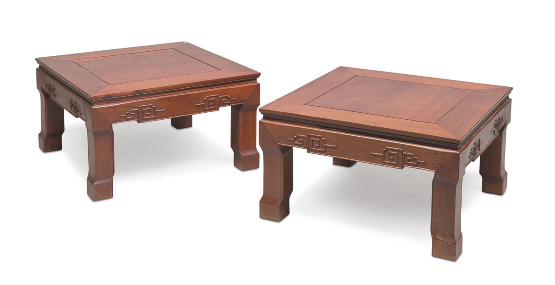 A PAIR OF COFFEE TABLES IN TEAK, CHINA 20TH CENTURY with square top and meander sculpted band.